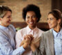 happy businesswomen supporting each other holding hands cafe 90x80